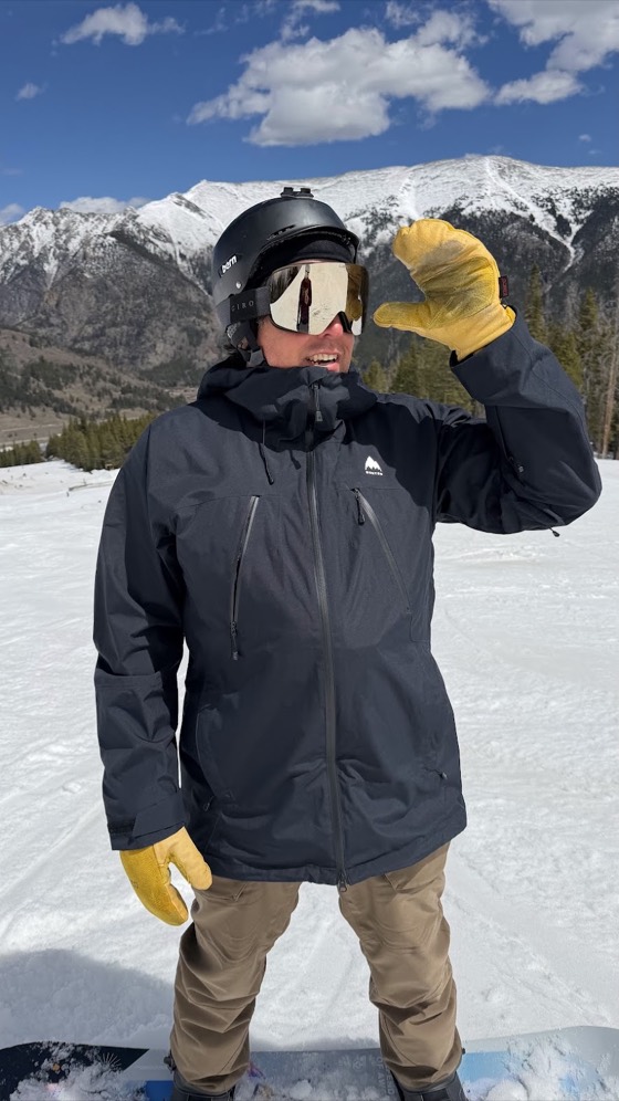 David on a groomed run at Copper Mountain in snowboard gear, the snow-covered Tenmile Range behind him.